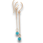 Load image into Gallery viewer, side view  of gold bar and turquoise earrings on a white background.
