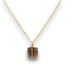 Load image into Gallery viewer, quare smoky quartz pendant double-wrapped in 14K gold-filled wire on an 18-inch chain.
